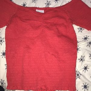 red smocked shirt
